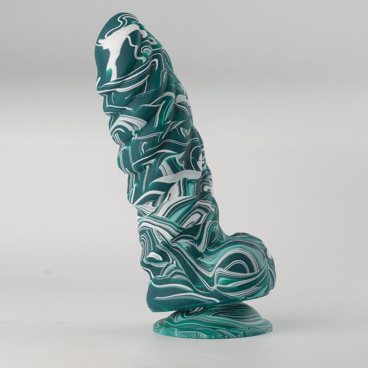 Griffin Fantasy Collection silicone dildo - low-angle side view standing on suction cup base showing strong upward curve, teal and white marble swirl colorway with fantasy rounded tip, dense layered scale-like surface texture and flared suction cup base - body-safe platinum-cured single-density silicone | RealTouch Lab
