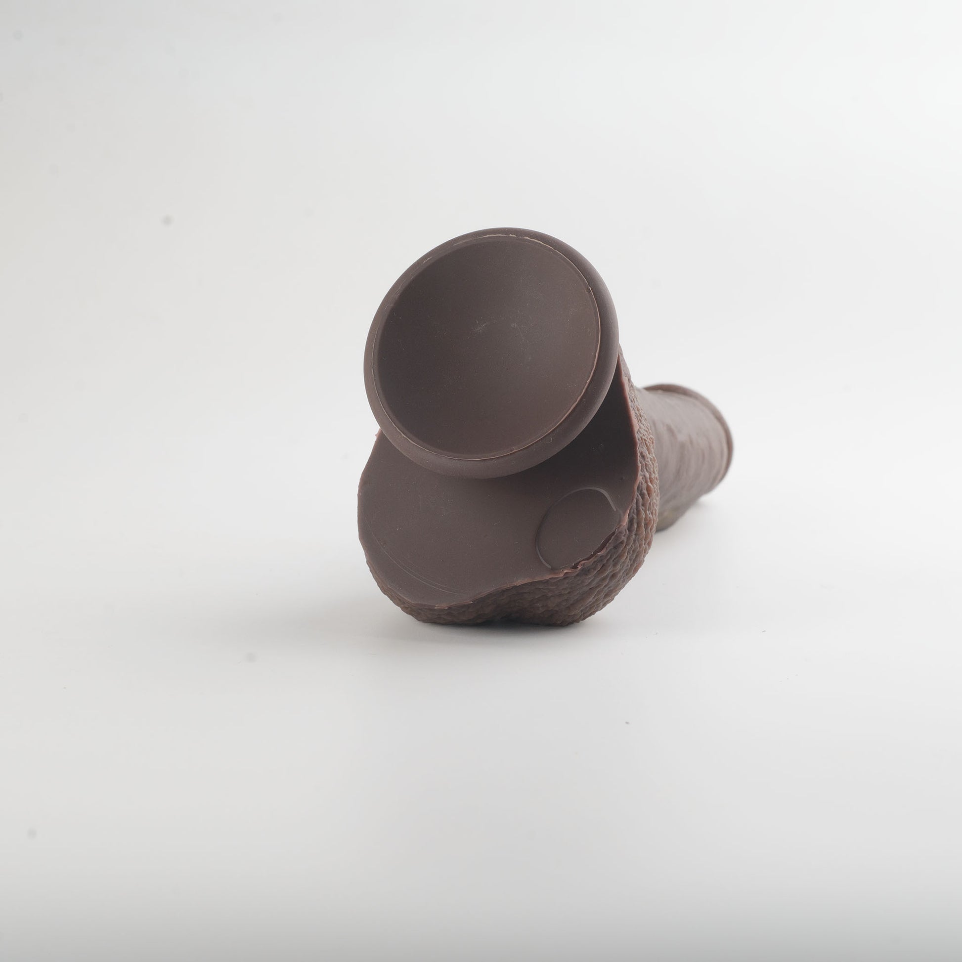 Stage 03 Giganotosaurus dual-density silicone dildo - close-up of strong suction cup base showing secure mounting surface - body-safe platinum-cured | RealTouch Lab
