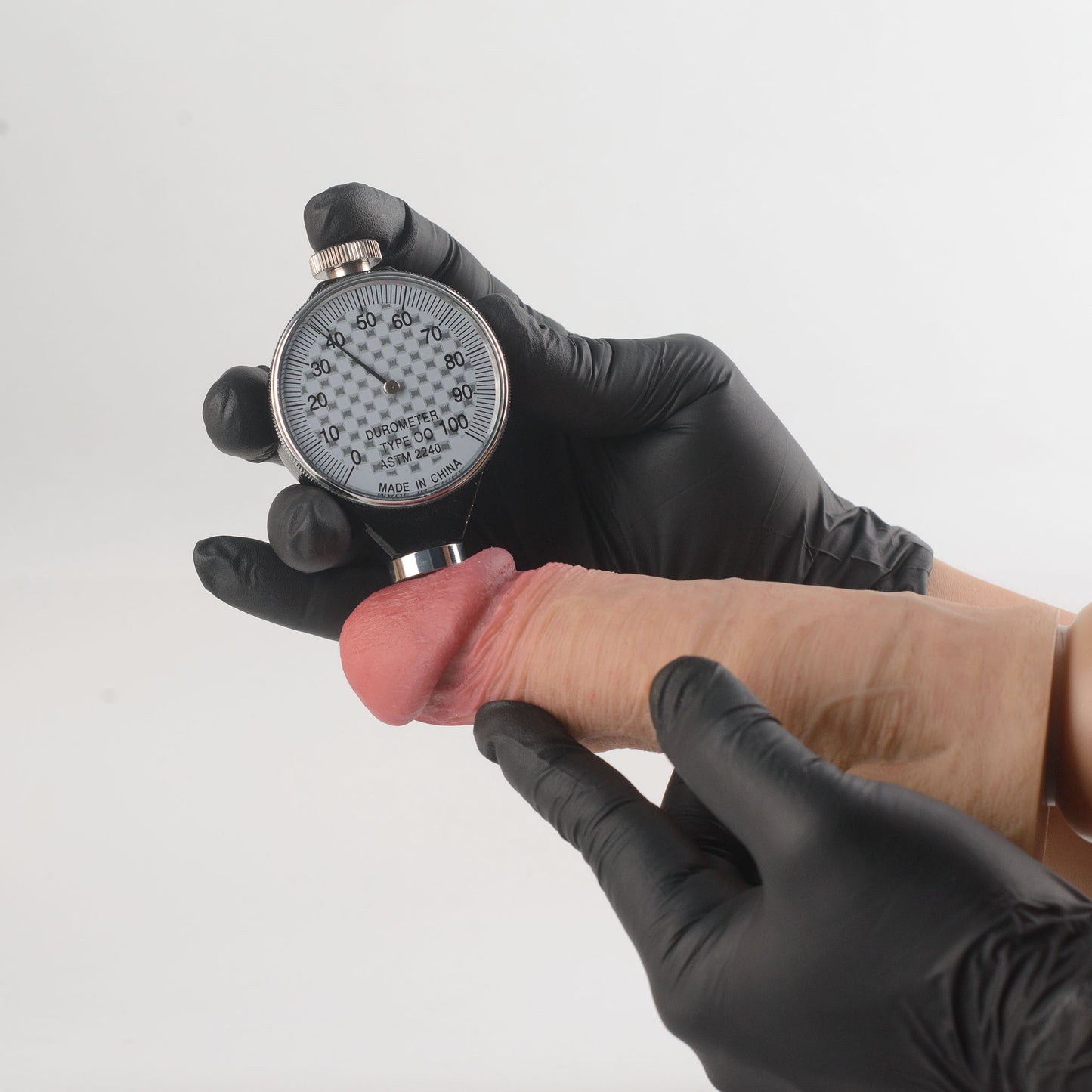Stage 05 Carnotaurus dual-density silicone dildo with Velvet Shield Coating - Shore 00 durometer Type OO ASTM 2240 hardness test on glans showing 38 Shore 00 softness rating - scientifically verified ultra-soft outer layer comparable to human tissue - dual-density body-safe platinum-cured | RealTouch Lab
