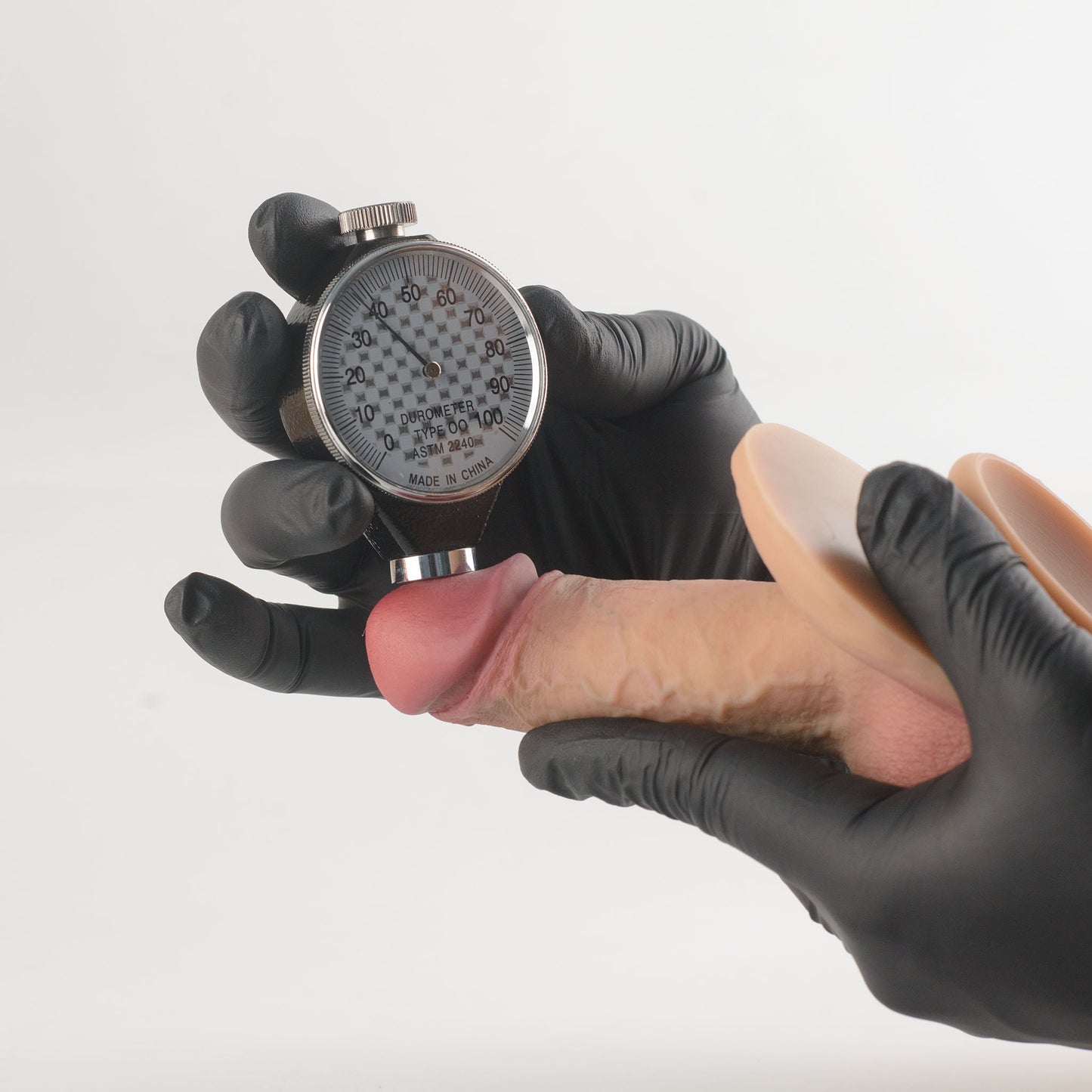 Stage 05 Ossifying Dragon dual-density silicone dildo - Shore 00 durometer Type OO ASTM 2240 hardness test on glans showing approximately 37 Shore 00 softness rating - scientifically verified ultra-soft outer layer comparable to human tissue - dual-density body-safe platinum-cured | RealTouch Lab
